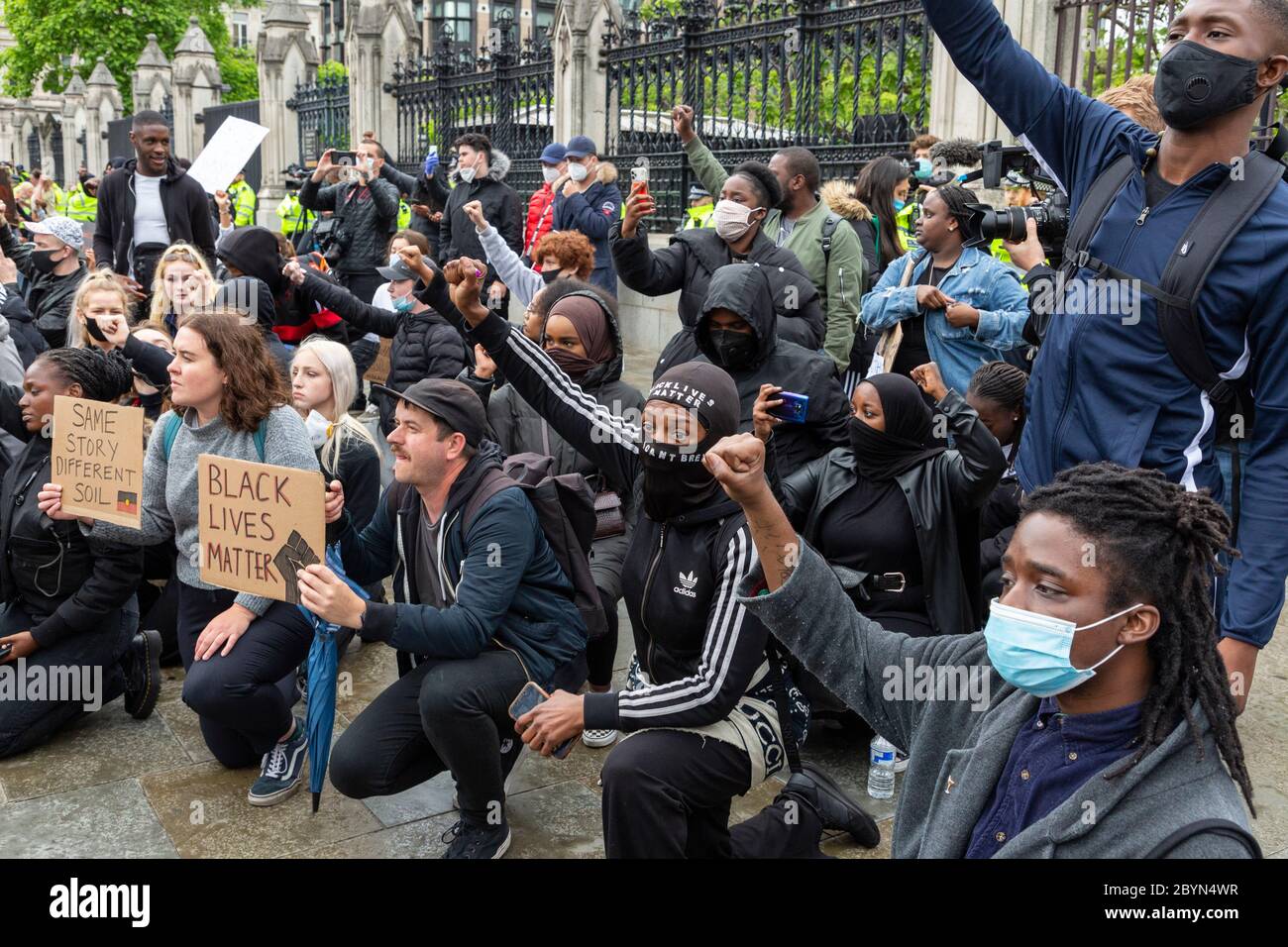 Protesters take the knee during a Black Lives Matters protest, Parliament Square, London, 7 June 2020 Stock Photo