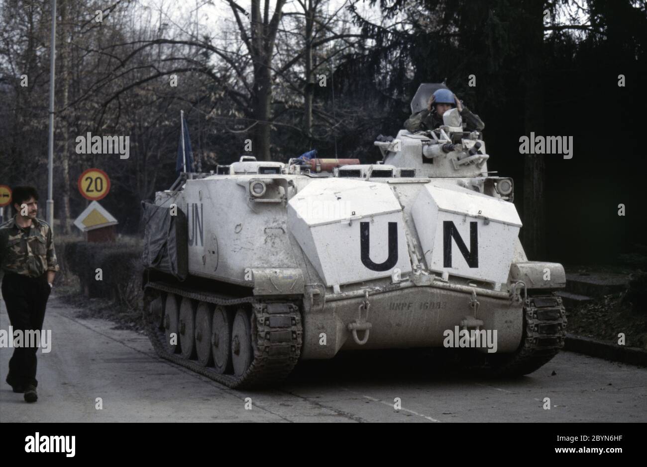 7th March 1994 During the war in Bosnia: a Swedish Häaglunds Pbv (Pansarbandvagn) 302 APC of Nordbat 2 stands guard at the entrance to Tuzla Airport. Stock Photo