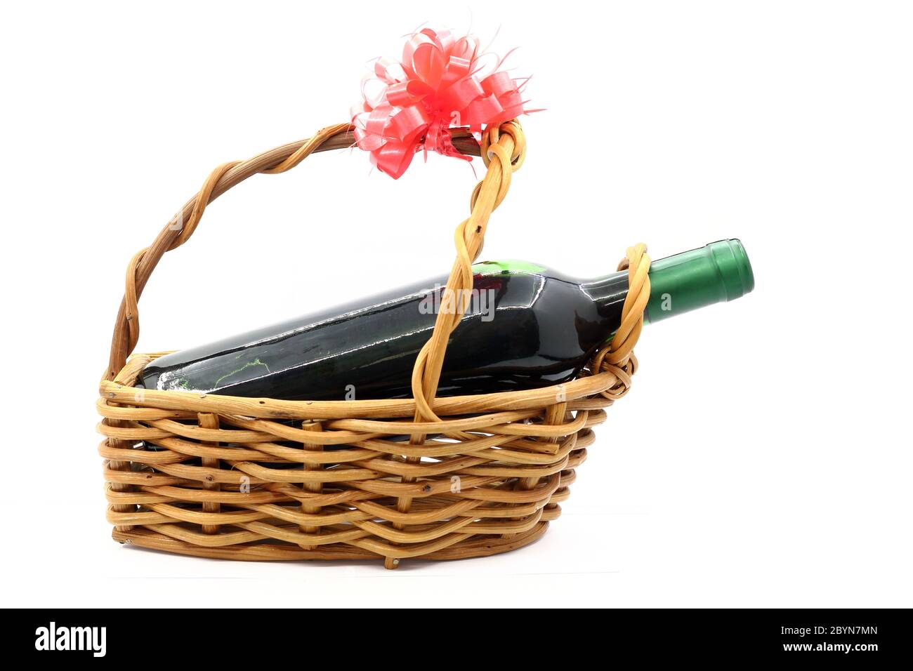wine bottle isolated in gift basket on white background Stock Photo - Alamy