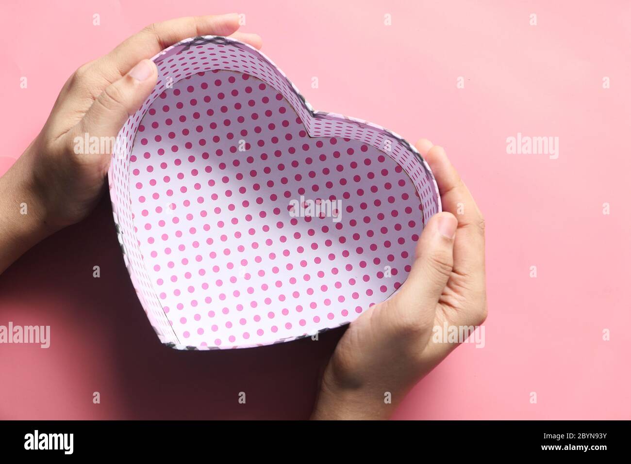 women hand holding empty gift box, top view  Stock Photo