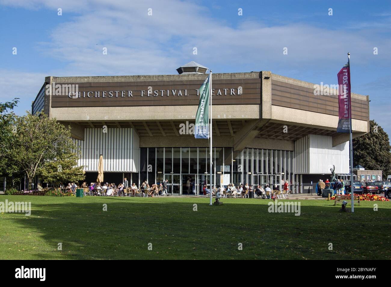 Chichester, UK - August 10, 2011:  Theatre goers enjoying the summer sunshine at Chichester Festival Theatre. The theatre continues to flourish despit Stock Photo