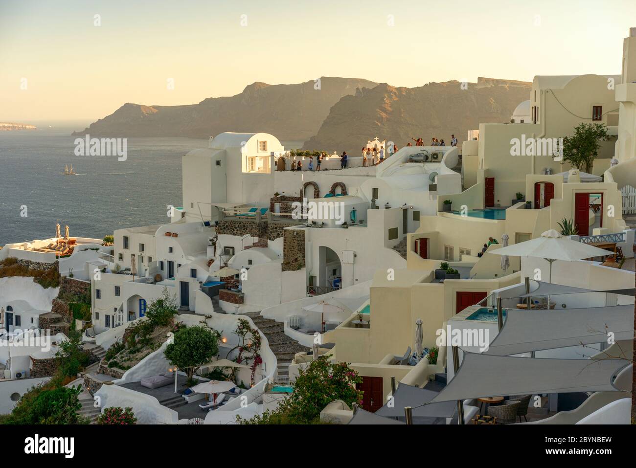 A view of Oia, built on the edge of the caldera in Santorini, Greece,  taken an hour or so before sunset. Stock Photo