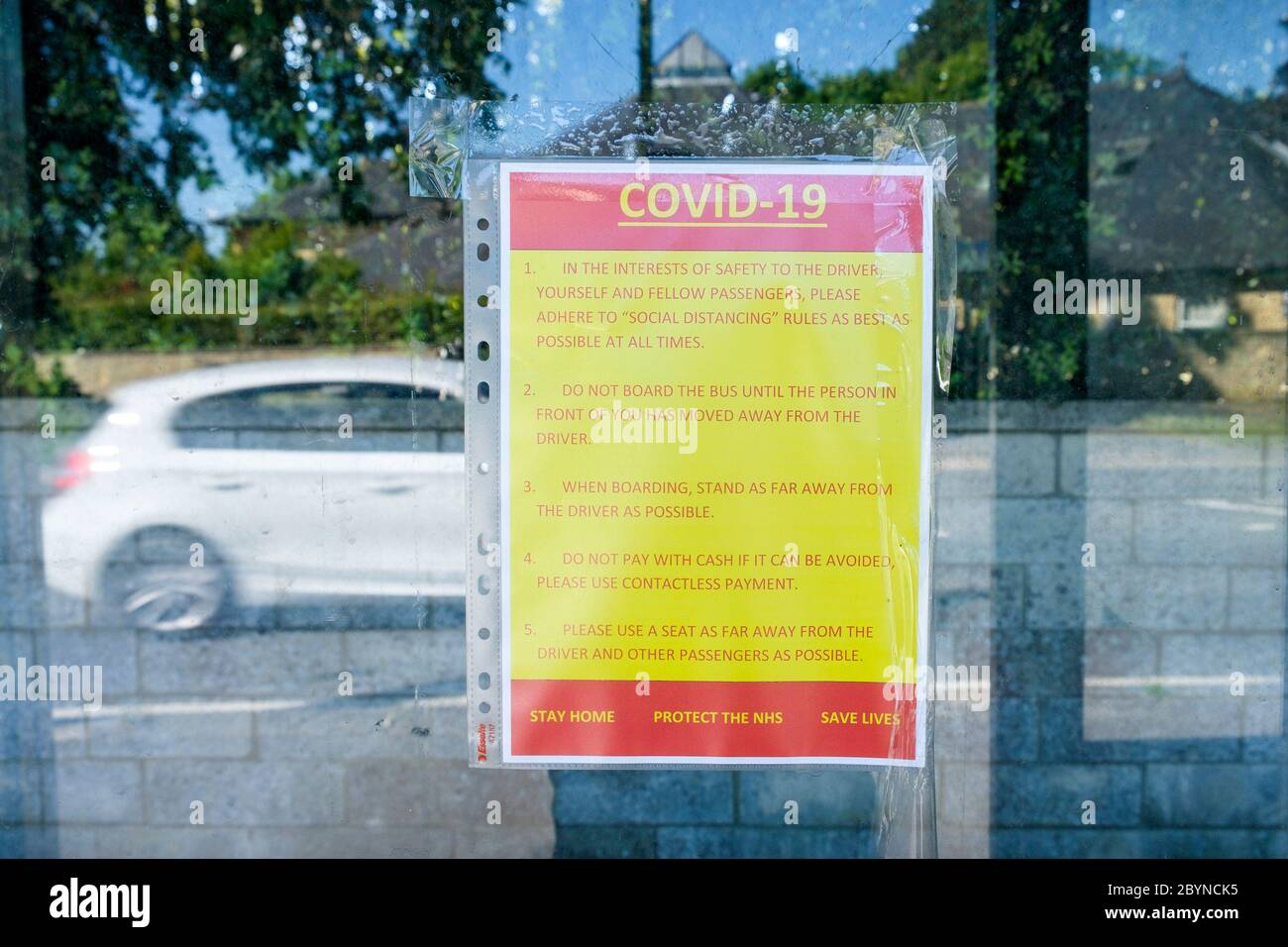 Sign at a bus stop informing passengers of the covid 19 coronavirus