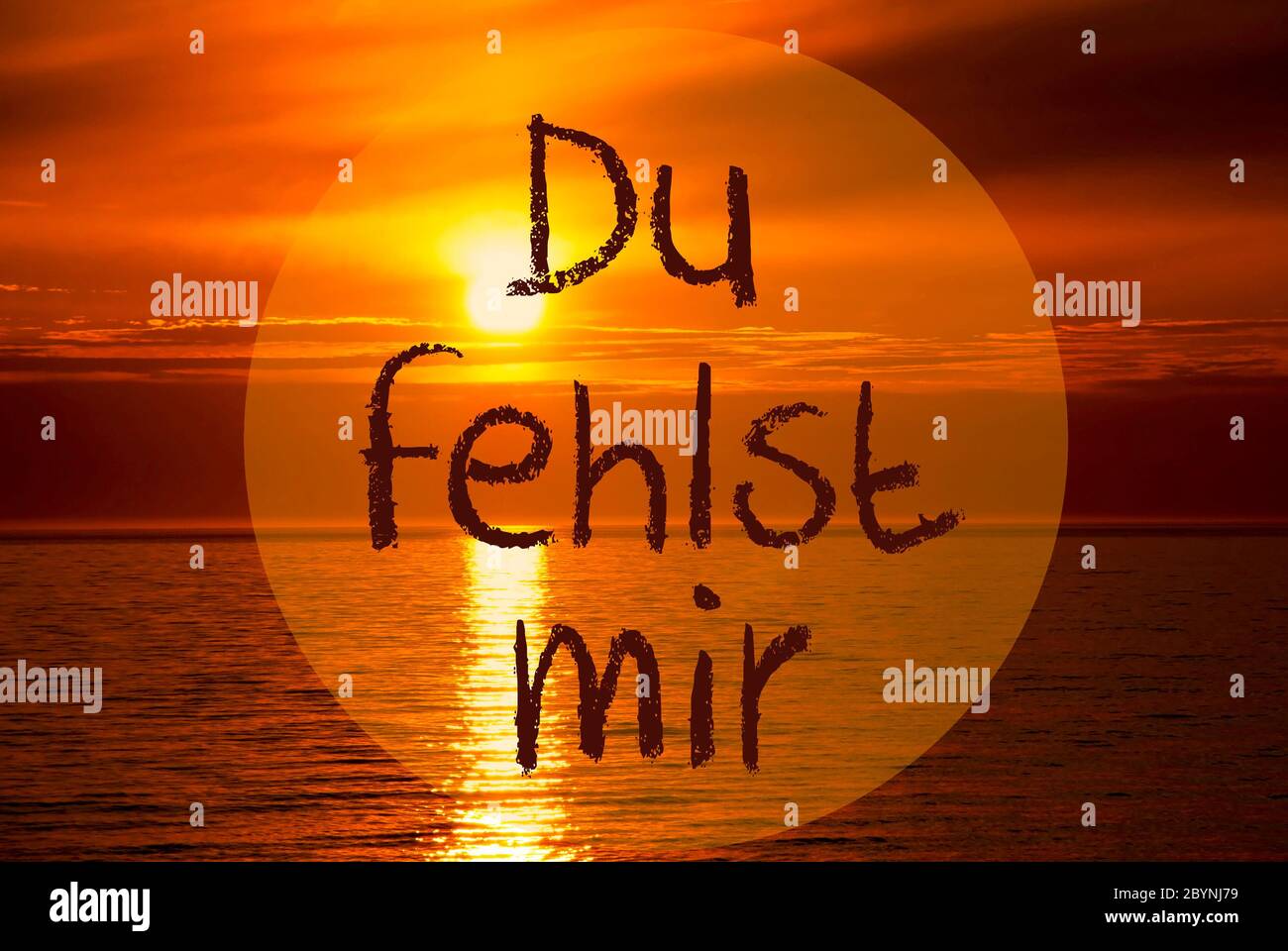 German Text Du Fehlst Mir Means I Miss You. Romantic Sunset Or Sunrise At  Sea Or Ocean In The Background Stock Photo - Alamy, image size:1300x960