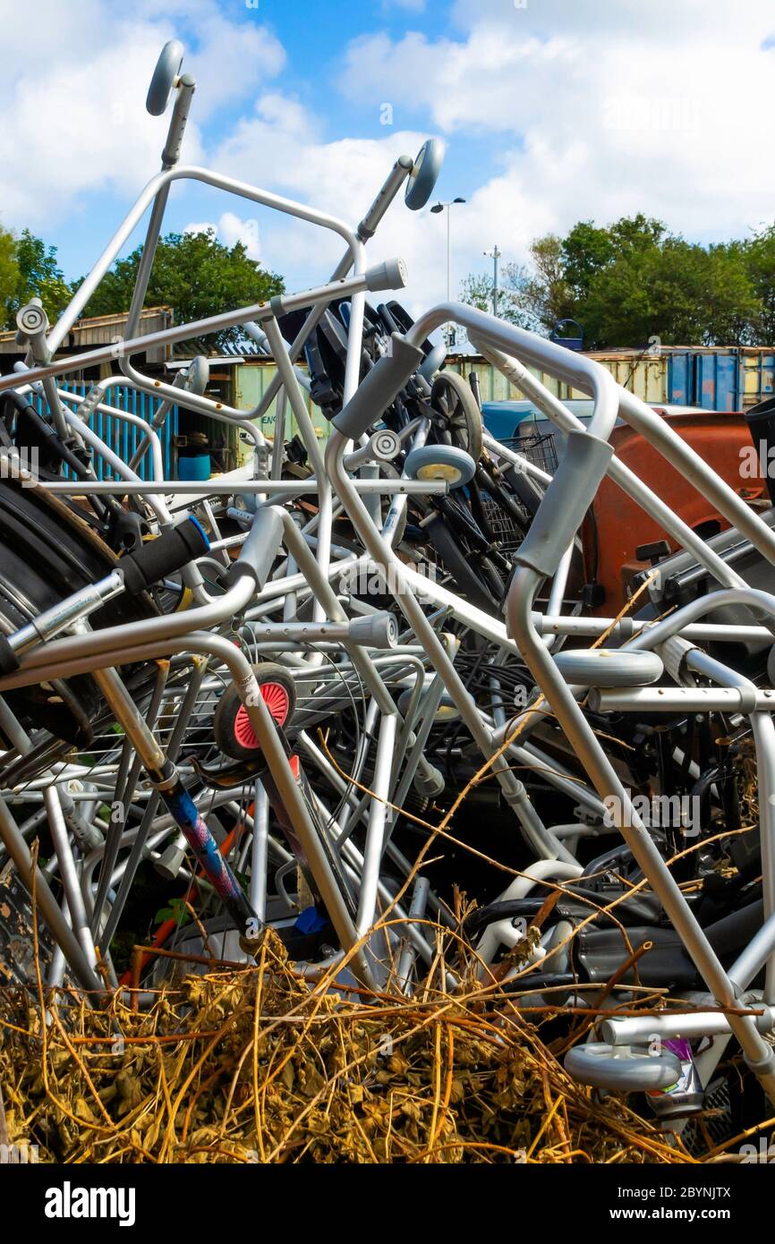 Scrap metal in a skip mainly zimmer frames or personal walking aids for disposal Stock Photo
