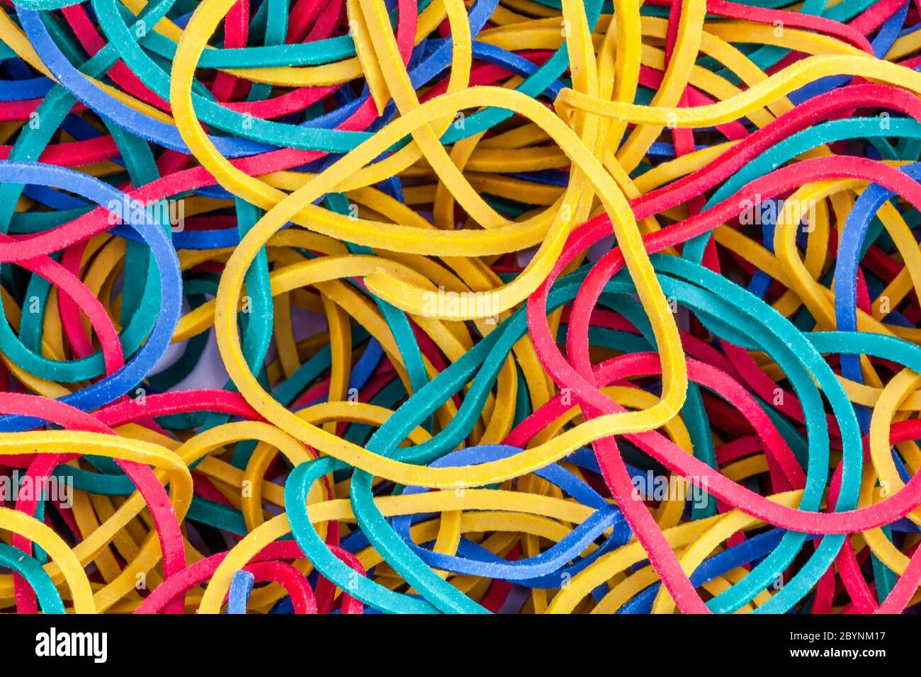 Premium Photo  Bunch of colorful multi color small rubber bands elastic  bands on a white background close up