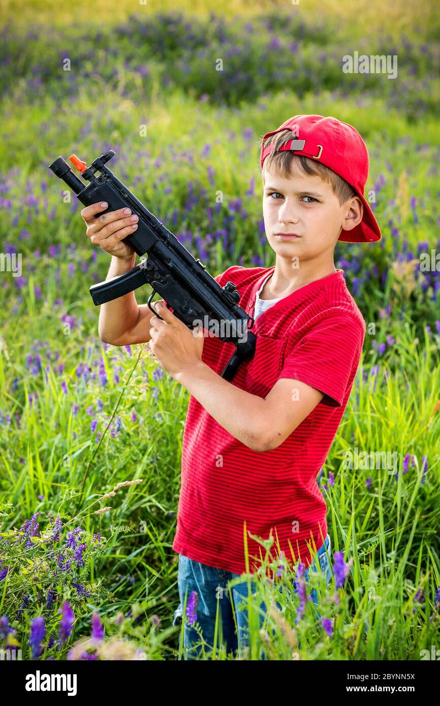Boy with a gun hires stock photography and images Alamy