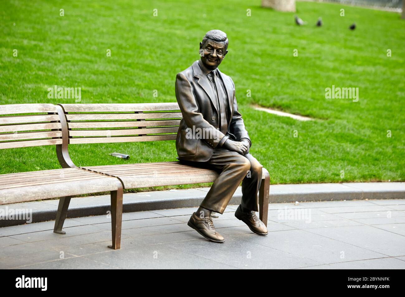 Statue of Mr Bean, played by Rowan Atkinson, part of a series of movie themed bronze sculptures in Leicester Square celebrating a century of cinema Stock Photo