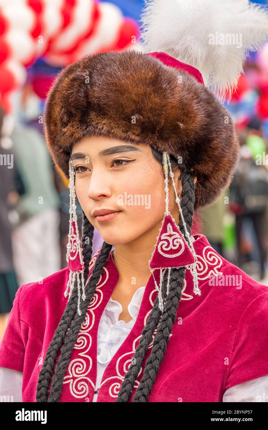 Young woman in traditional clothing during a festival in Osh Kyrgyzstan Stock Photo