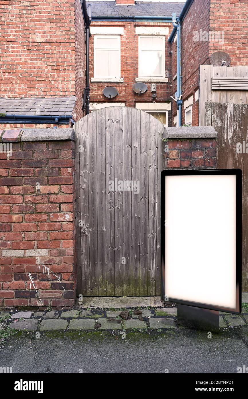 Poster billboard on city dirty alley background .Blank advertising billboard mockup in the street Stock Photo