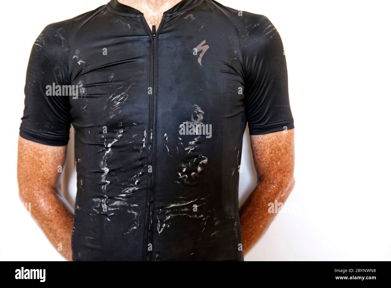 View of dried sweat marks on the wicking jersey worn by a male cyclist