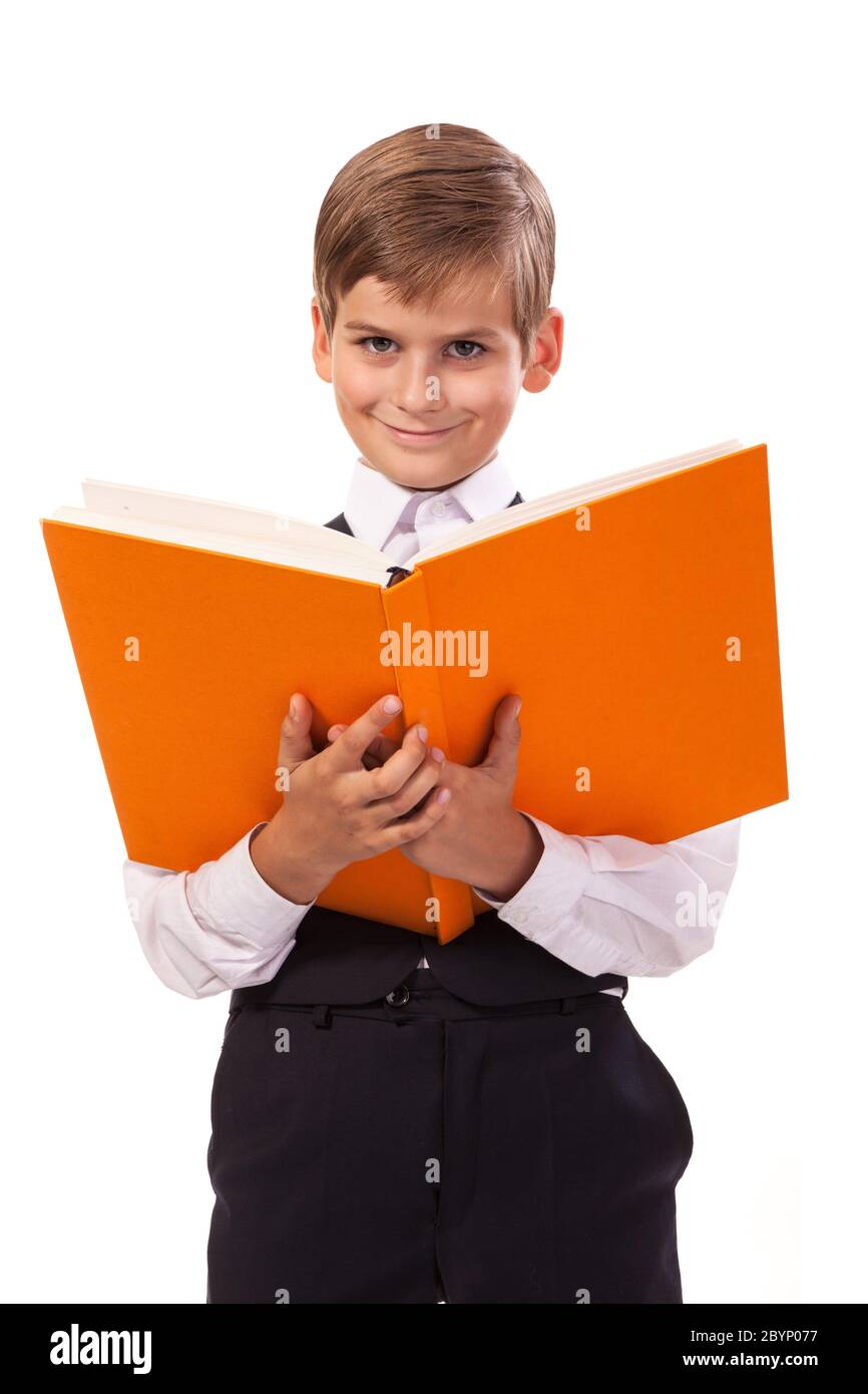 School boy is holding a book Stock Photo - Alamy