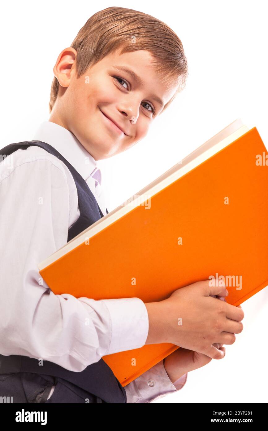School boy is holding a book Stock Photo - Alamy