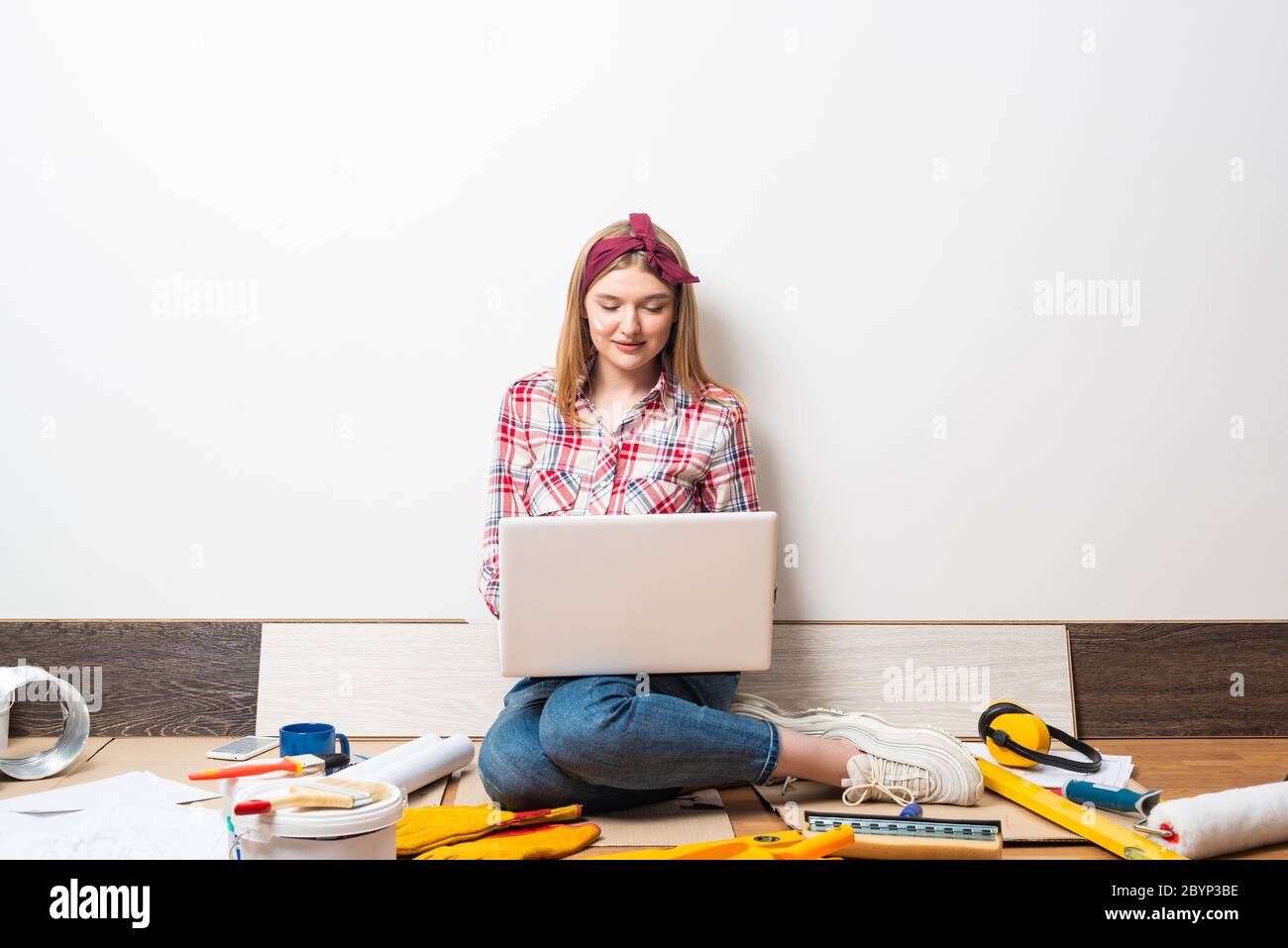 Beautiful girl using laptop computer at home Stock Photo - Alamy