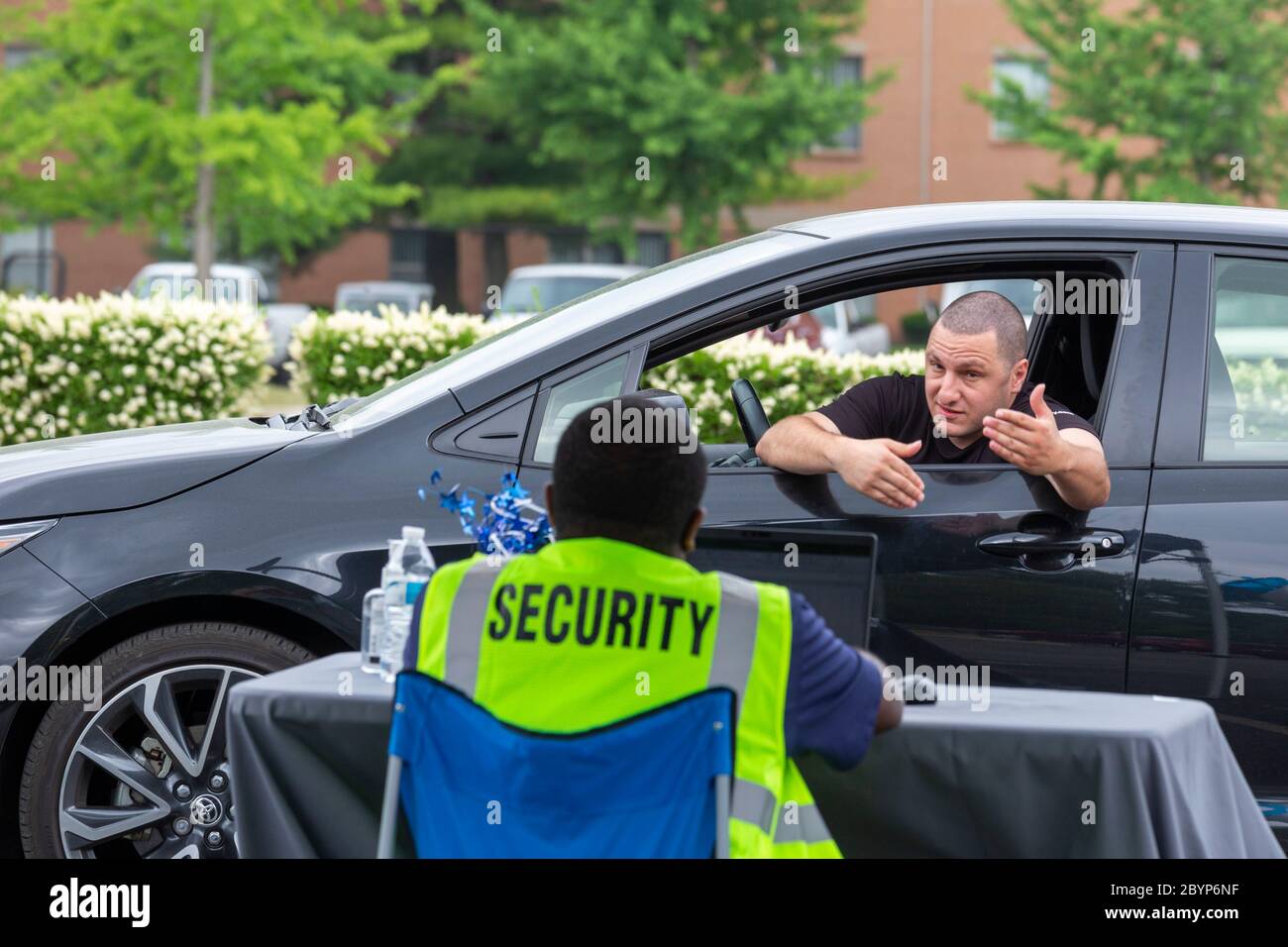 Detroit, Michigan, USA. 10th June, 2020. During the coronavirus pandemic, Allied Universal, a major security company, held a drive-through job fair in a church parking lot. The event allowed candidates for security officer positions to maintain social distancing through the interview process. Credit: Jim West/Alamy Live News Stock Photo