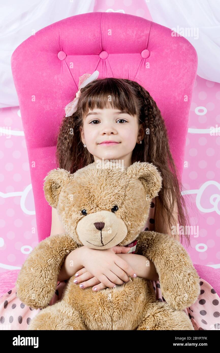 Little Girl Hugging Teddy Bear Stock Photo - Alamy