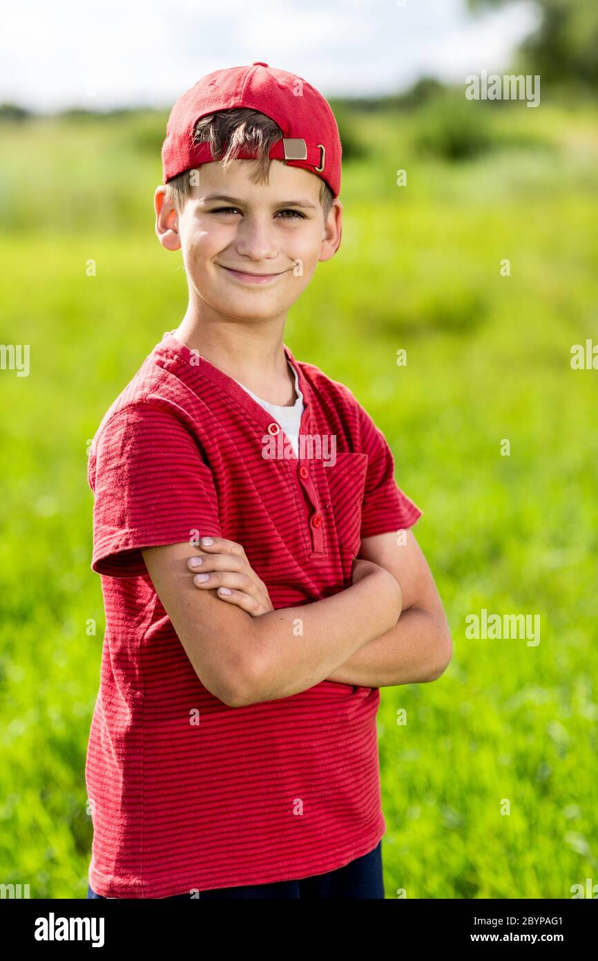 Boy Child Portrait Smiling Cute ten years old outdoor Stock Photo