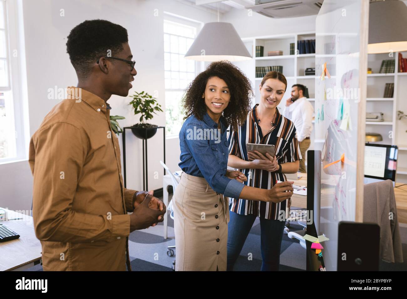 Multi races happy businesspeople working in a workspace Stock Photo
