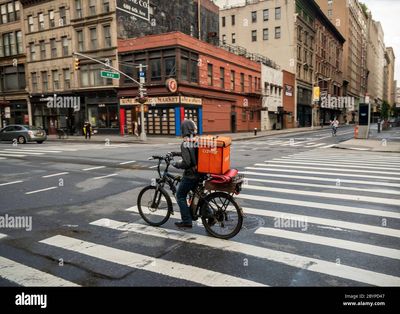 A delivery worker with a Caviar branded tote in Chelsea in New York on Saturday June 6 2020. Richard B. Levine Stock Photo Alamy