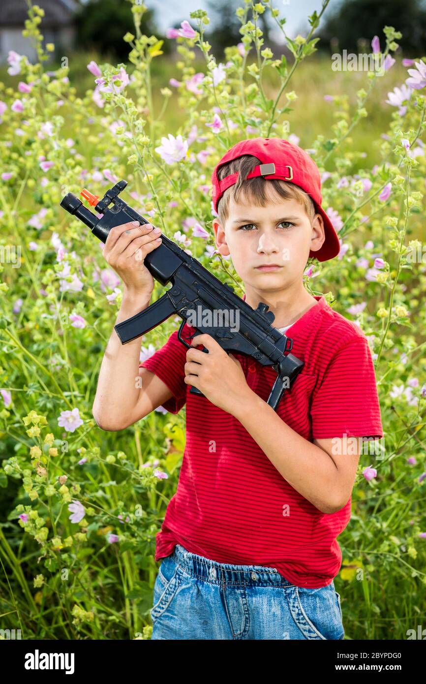 Boy with a gun hires stock photography and images Alamy