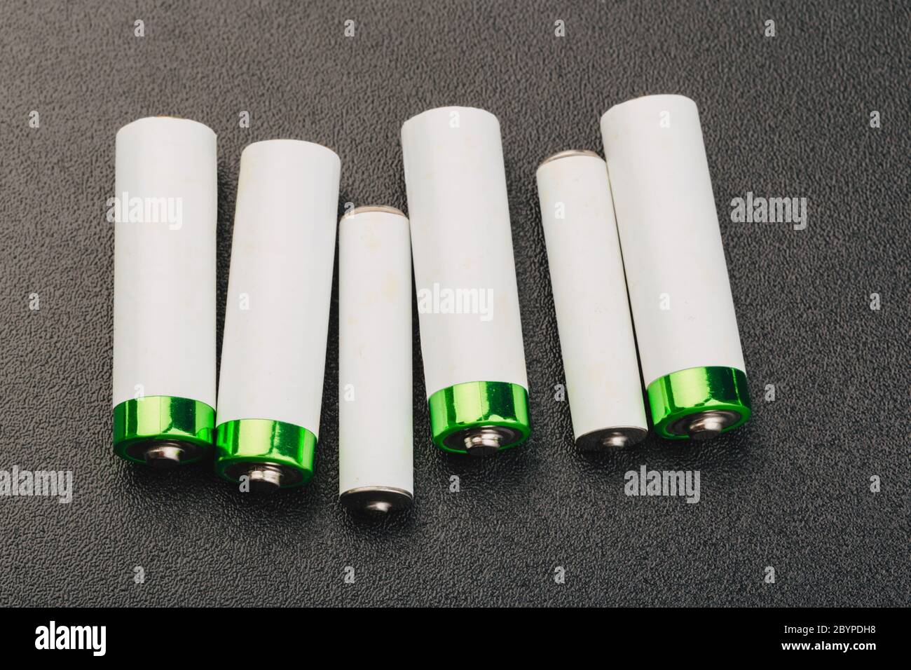 close up of battery positive poles on black backgrounds. intended focused Stock Photo