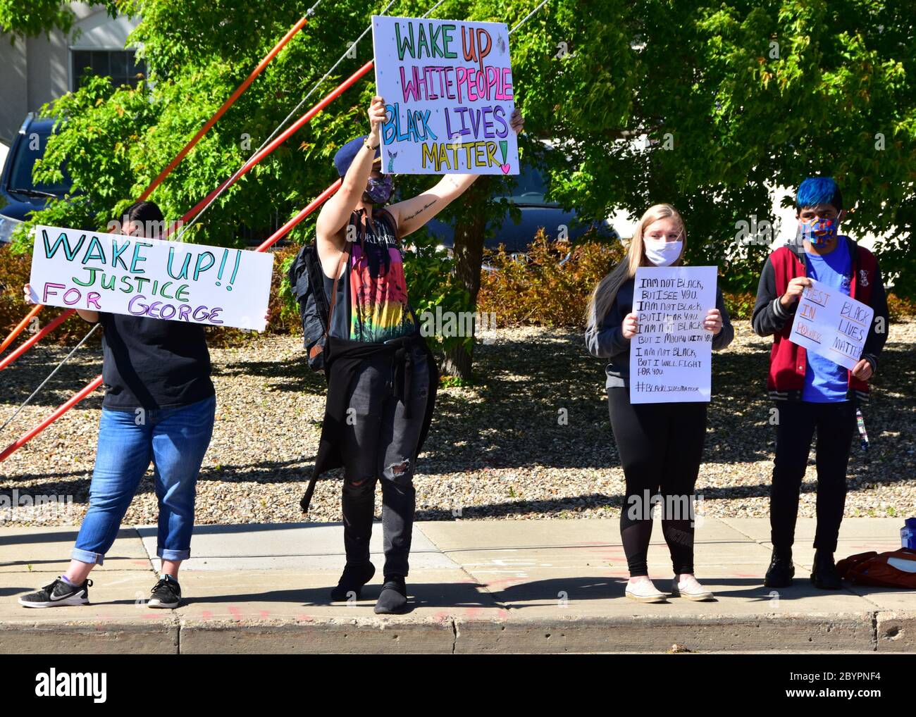 Bismarck, ND, USA. May 29, 2020  People with signs and banners march through streets in the city protesting the death of George Floyd. Stock Photo