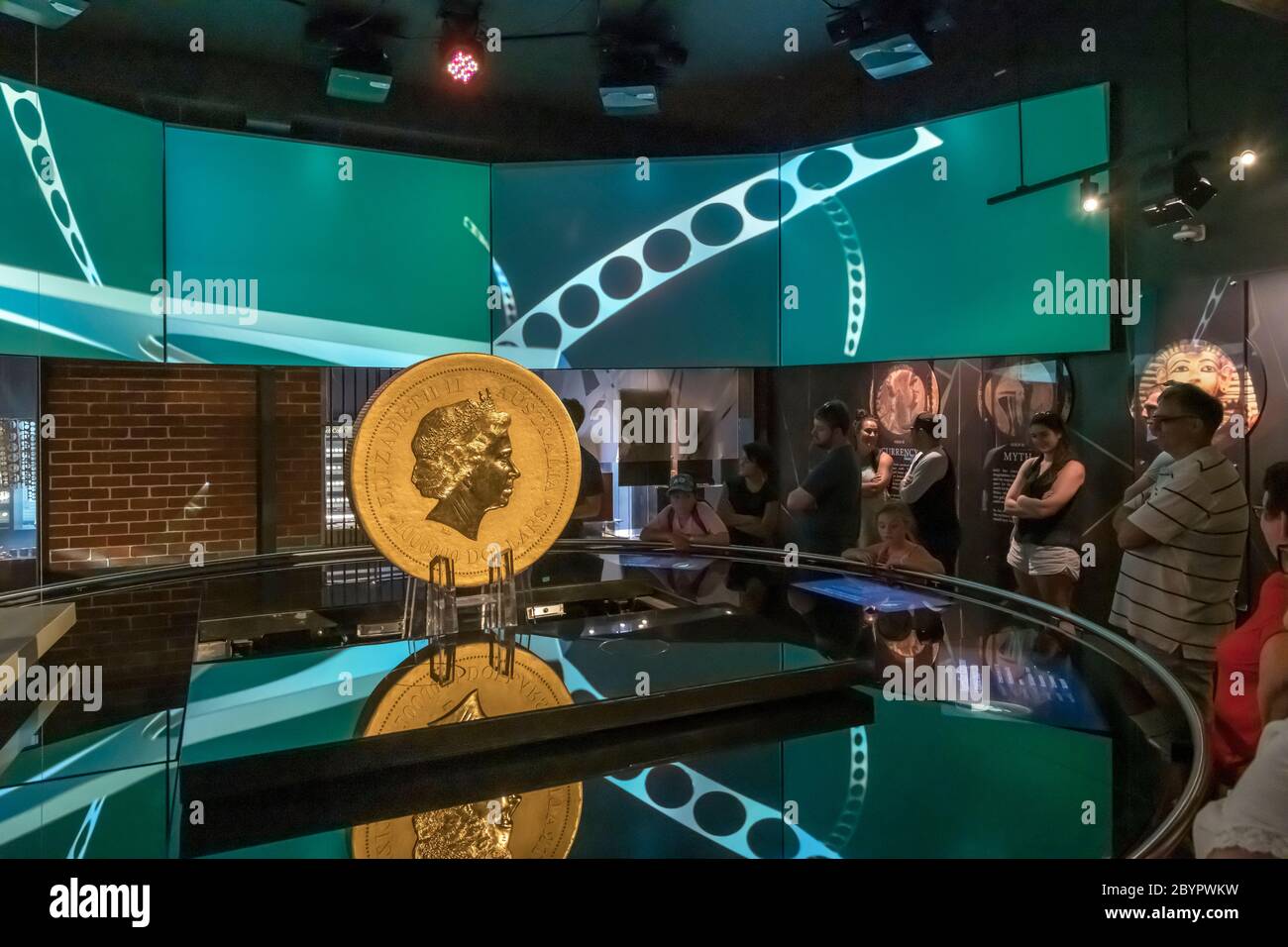 Visitors looking at the World's larges gold coin, the 1 tonne Australian Kangaroo, Perth Mint, Perth, Western Australia, Australia. Stock Photo
