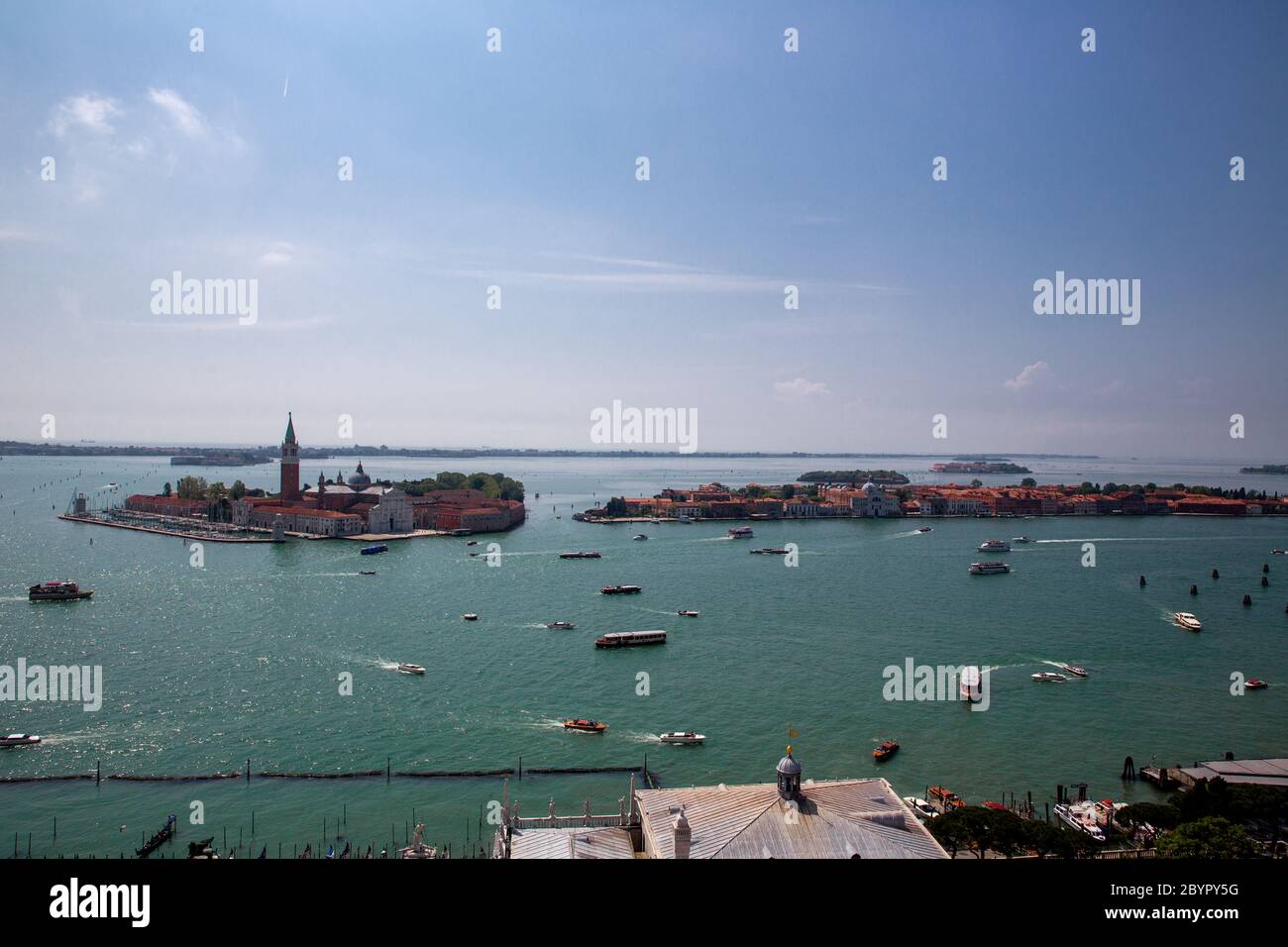 Islands of San Giorgio Maggiore, Giudecca and San Lazzaro degli Armeni. Heavy ship, boat and Vaporetto traffic in Venetian Lagoon as seen from St. Mar Stock Photo