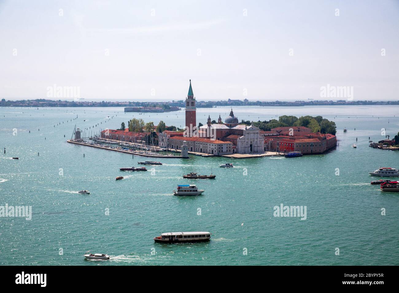 Island and Church of San Giorgio Maggiore, Heavy ship, boat and Vaporetto traffic in Venetian Lagoon as seen from St. Mark's Campanile, Venice, Italy Stock Photo