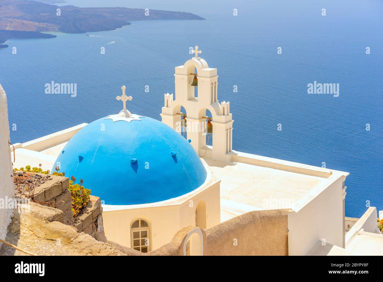 The Blue domed Virgin Mary Catholic Church and the three bells of Fira