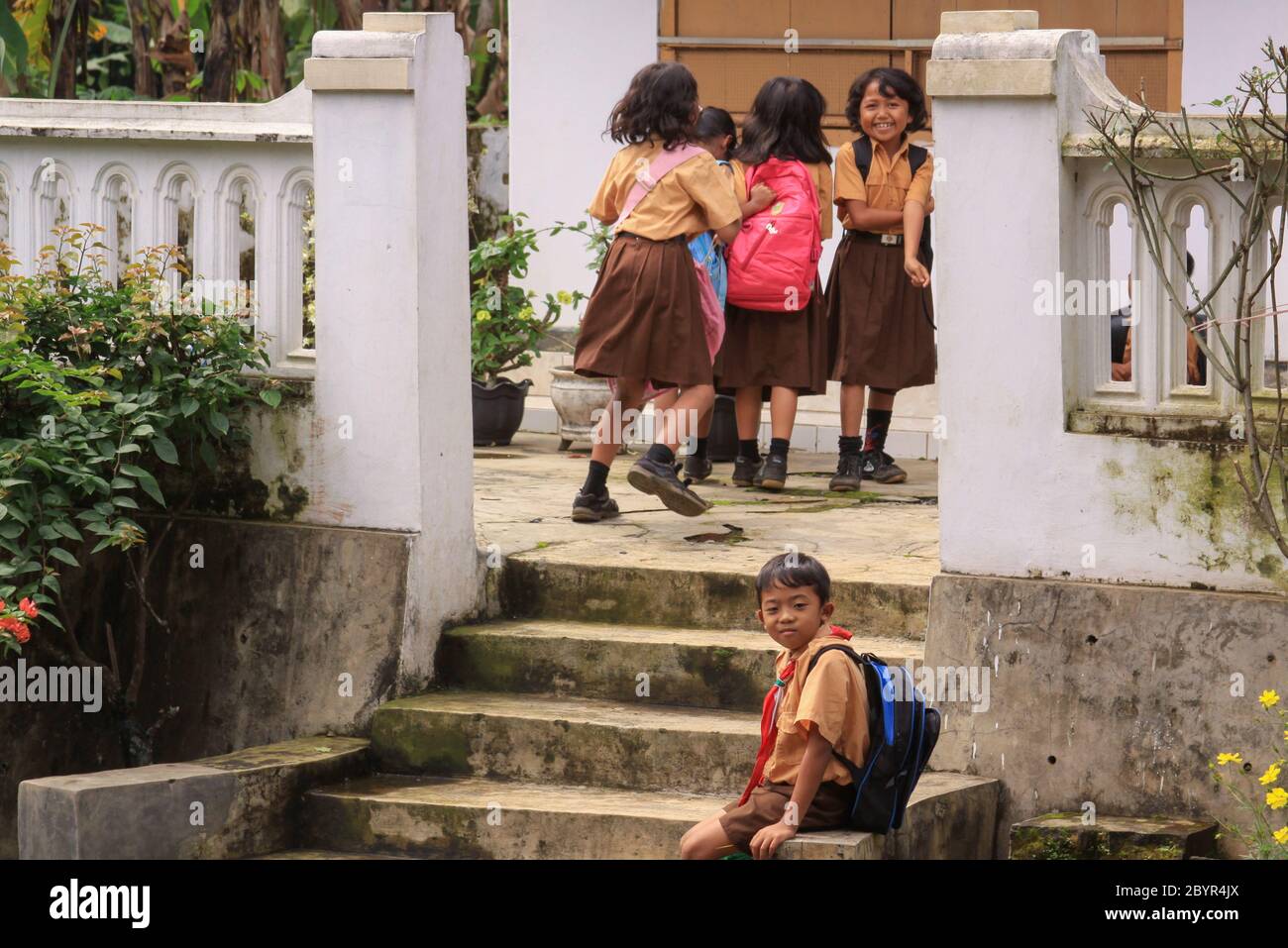 Probolinggo, Indonesia - June 14, 2013: Happy children smiling and playing after school in a village in East Java, Indonesia Stock Photo