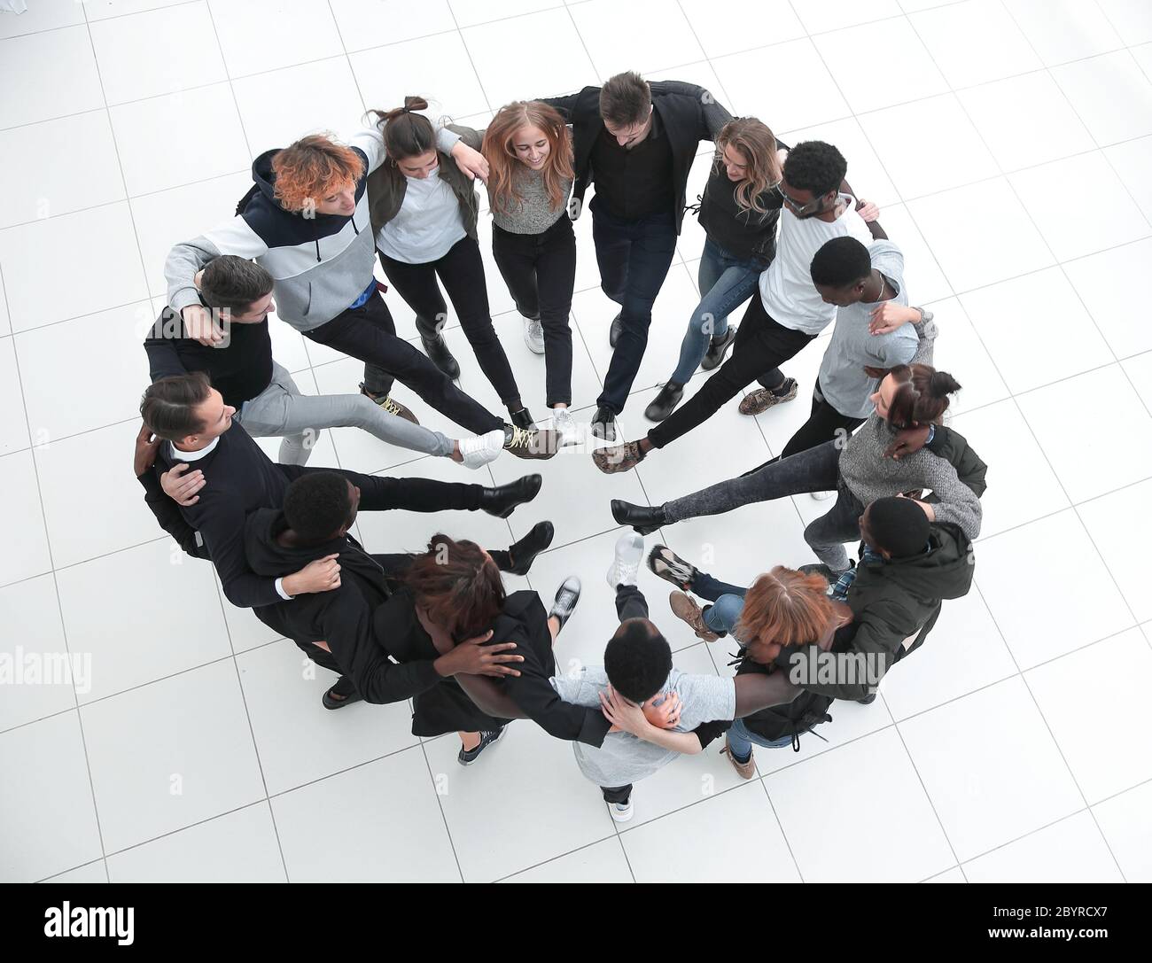 a group of people around foot to foot Stock Photo - Alamy