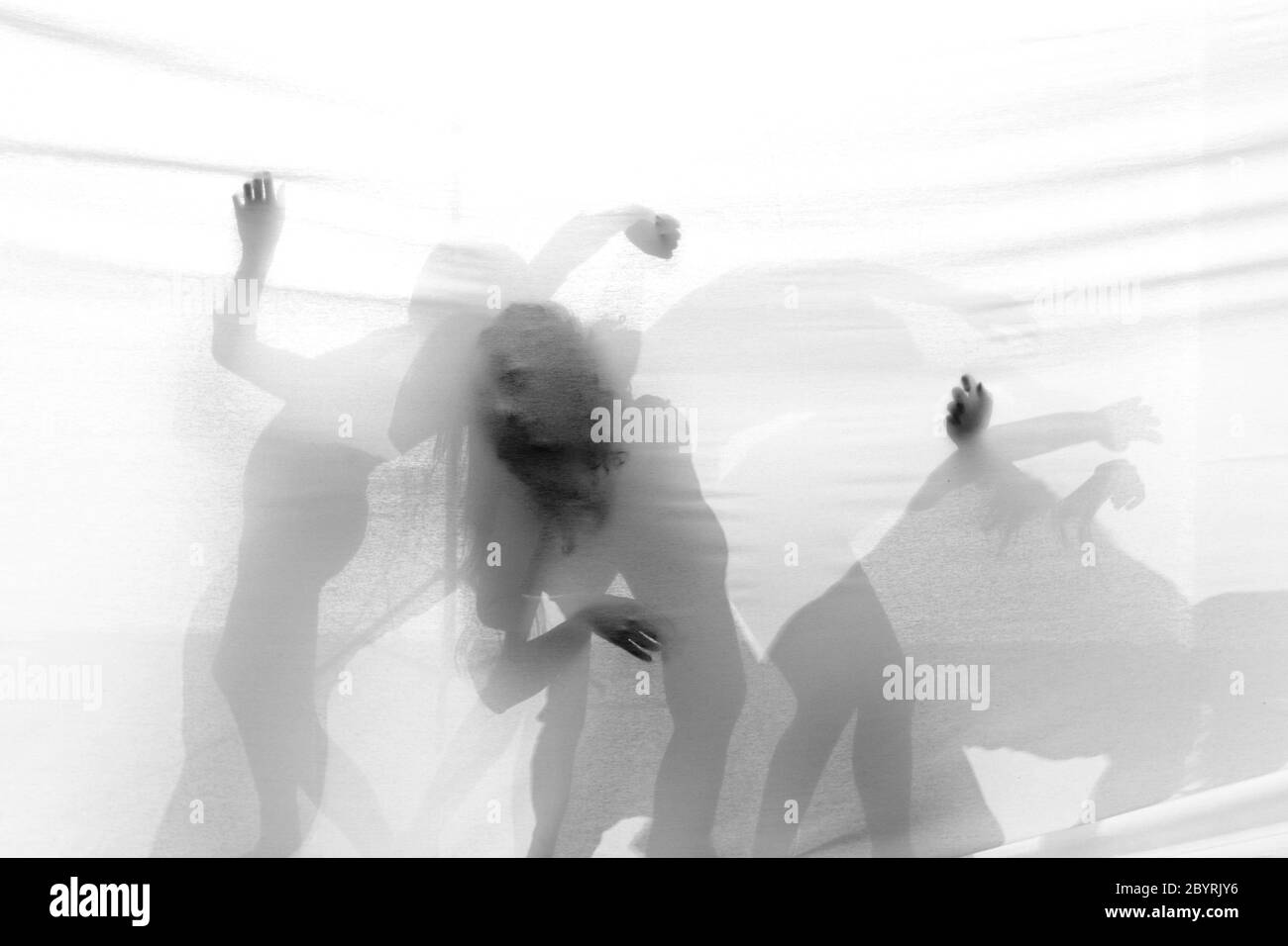 Group of contemporary dancers performing on stage Stock Photo