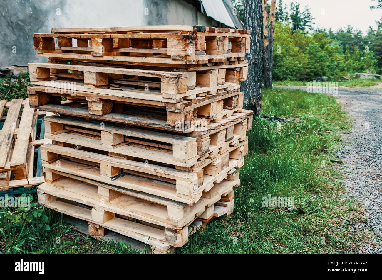 Stacked wooden pallets are stacked on the streets outside the premises
