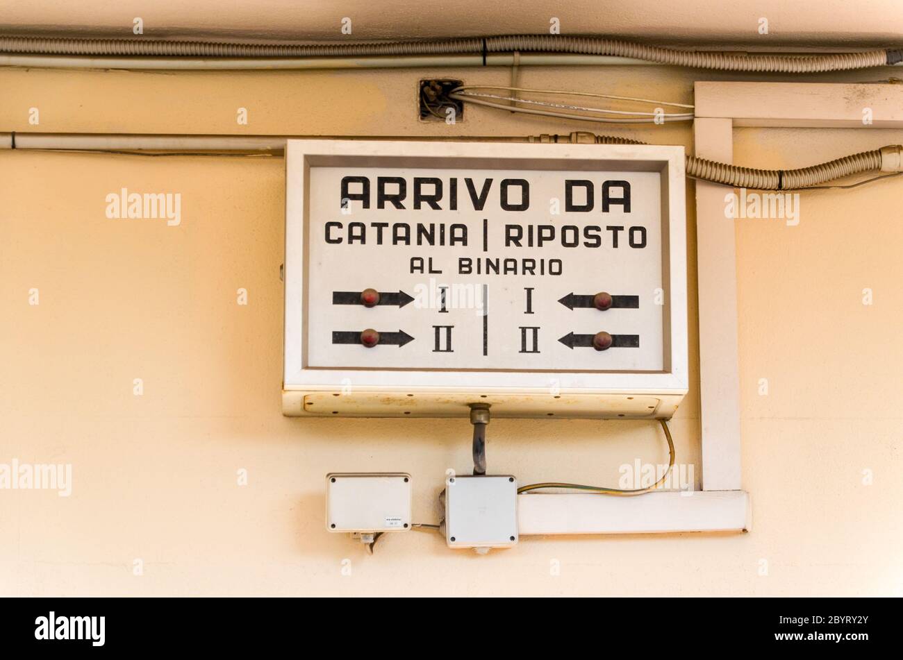 Train signs on the Ferrovia Circumetnea, train line around the Mount Etna, Sicily, Italy Stock Photo