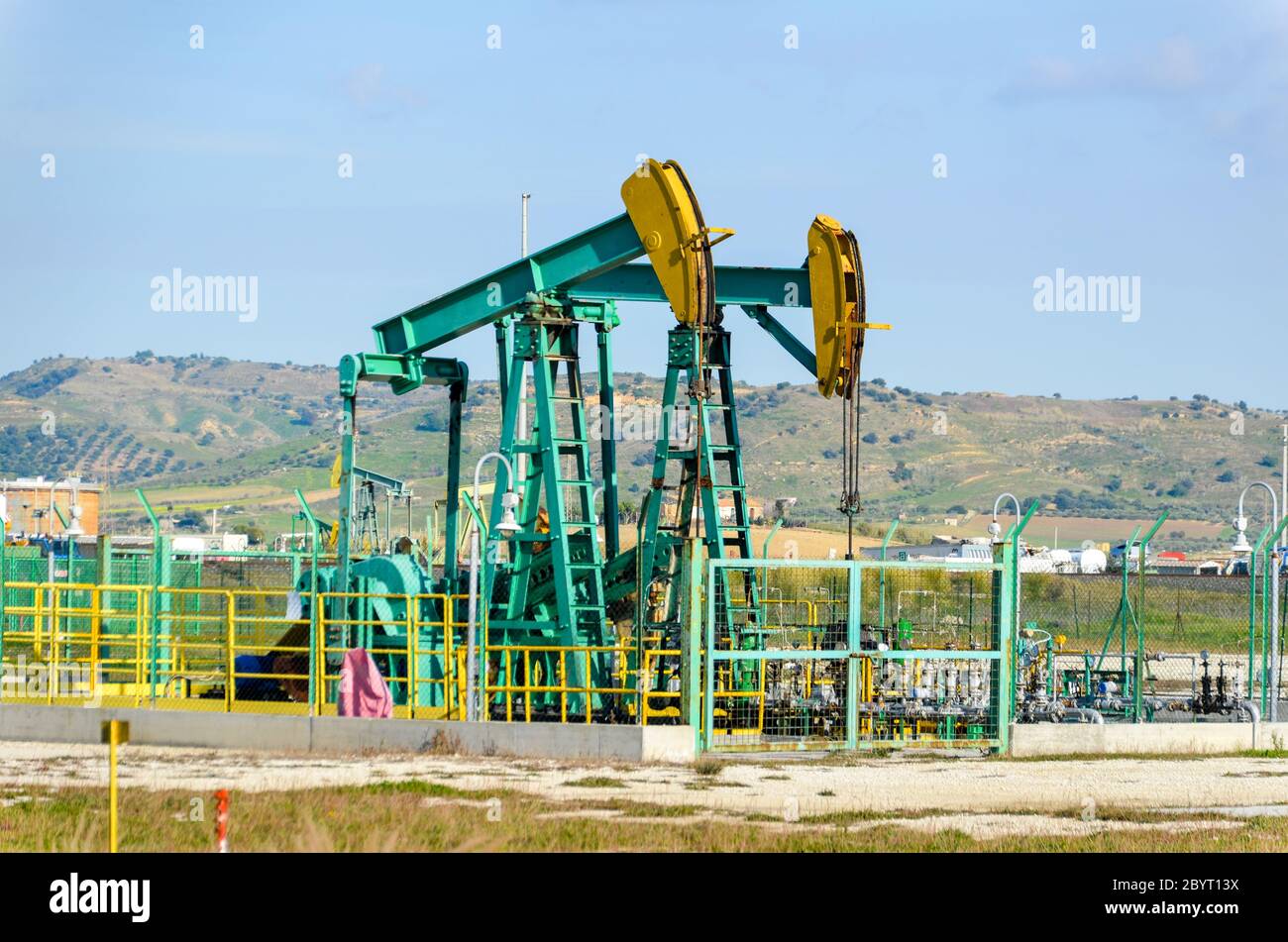Oil pumpjack at the Gela Refinery, Sicily, Italy Stock Photo