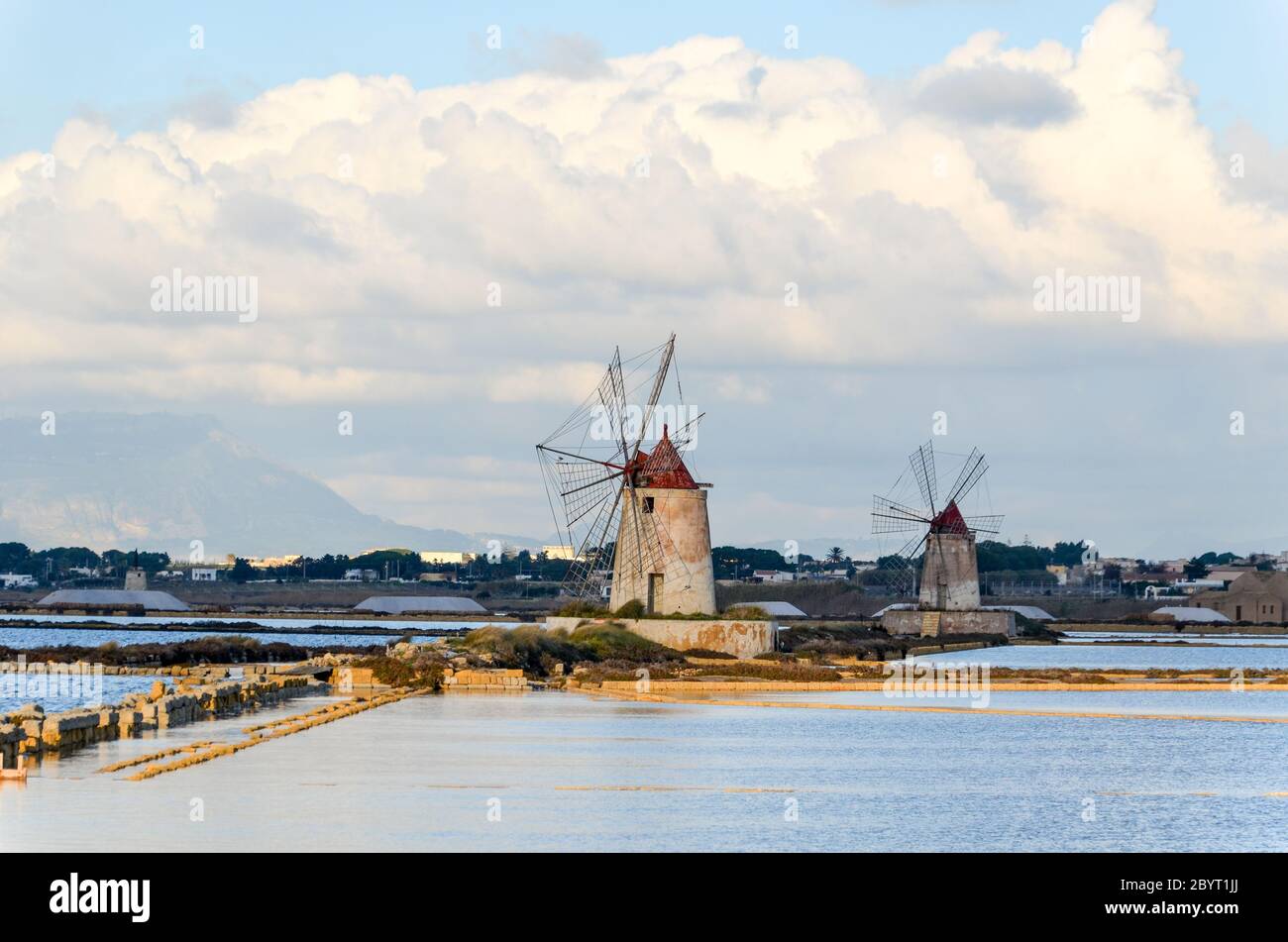 Windmills in the salt pans of Stagnone, Sicily, Italy Stock Photo