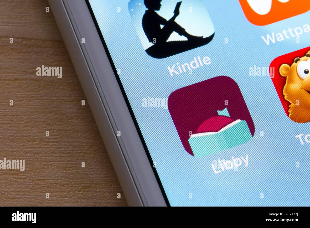 Libby app icon is seen on an iPhone. Libby, built by OverDrive, is a free app where users can borrow ebooks & digital audiobooks from public libraries. Stock Photo