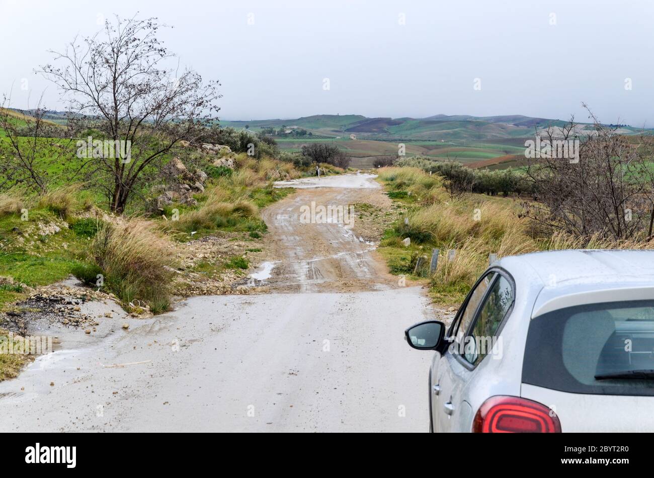 Unmaintained roads near the abandoned village of Borgo Pietro Lupo, in the countryside of Sicily, Italy Stock Photo