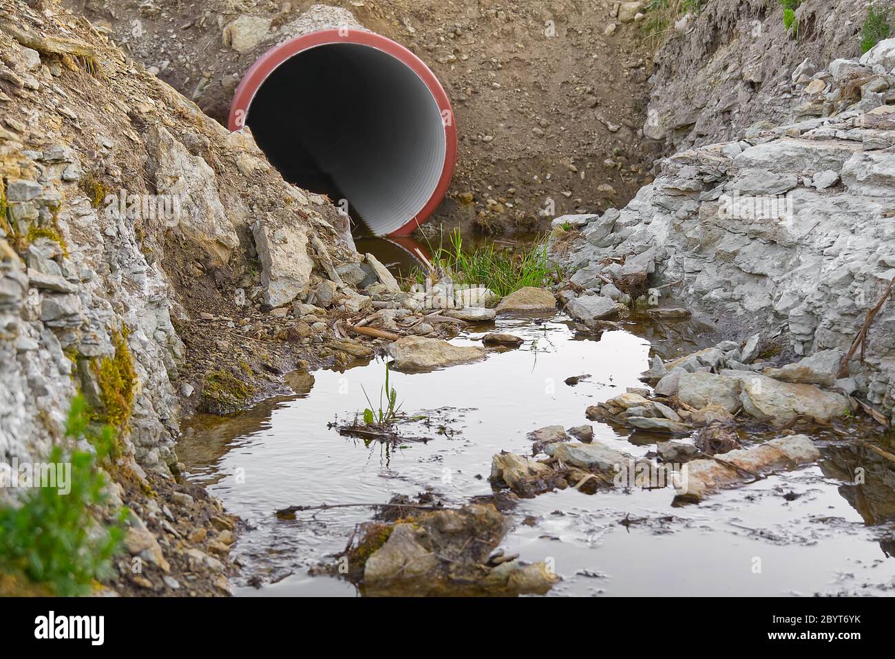 construction of a drainage ditch with plastic pipes. development of a