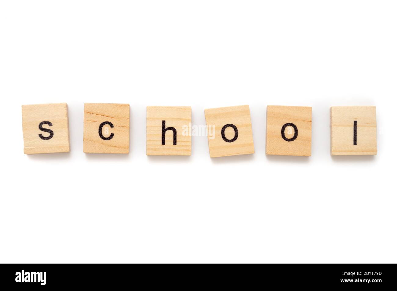 Wood letter tiles spelling the word SCHOOL isolated on a white background Stock Photo