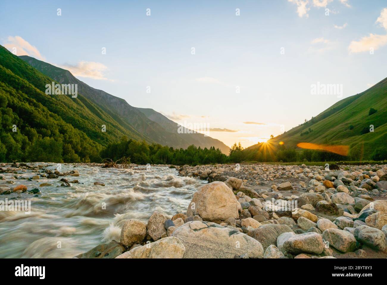 Svaneti landscape at sunset with mountains and river on the trekking and hiking route near Mestia village in Svaneti region, Georgia. Stock Photo