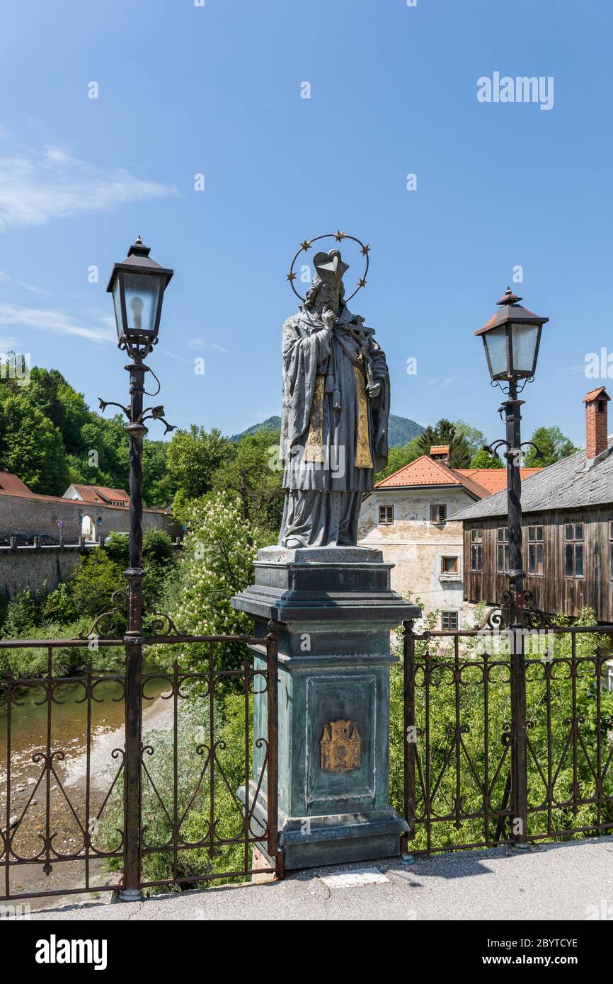 Statue of St. John of Nepomuk on the Capuchin’s Bridge in Skofja Loka ...