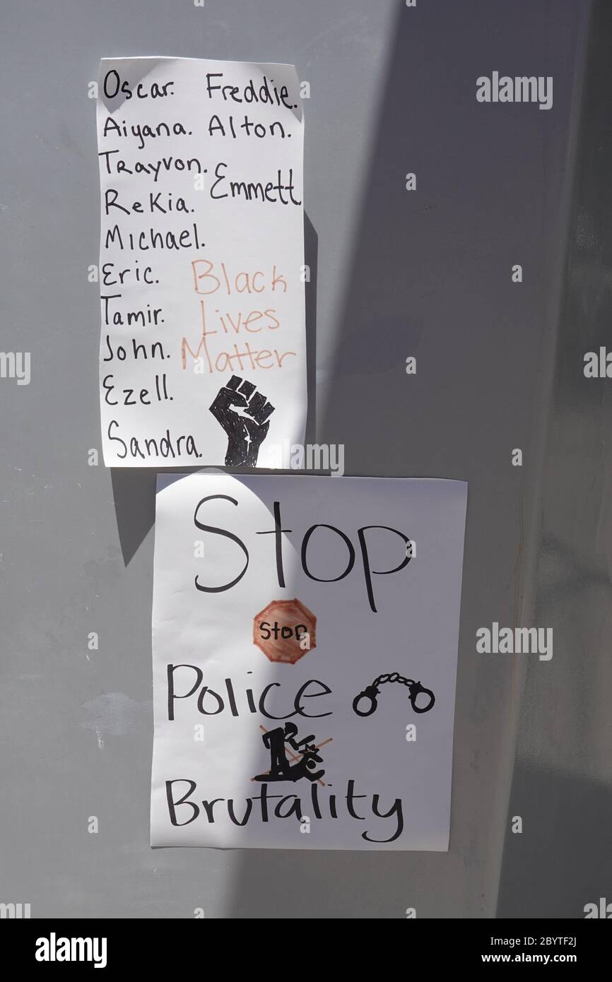 A handwritten sign saying stop police brutality. Stock Photo