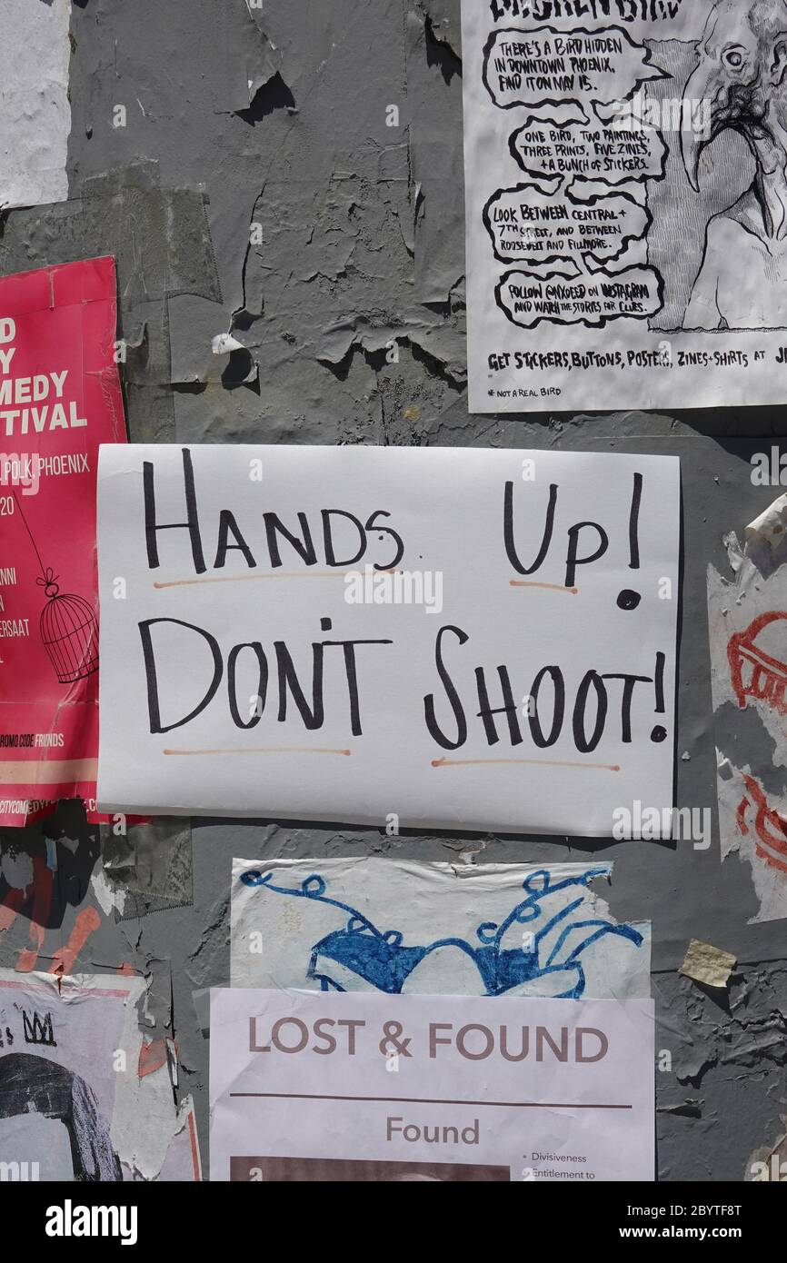 A hands up don’t shoot sign on a flier board. Stock Photo