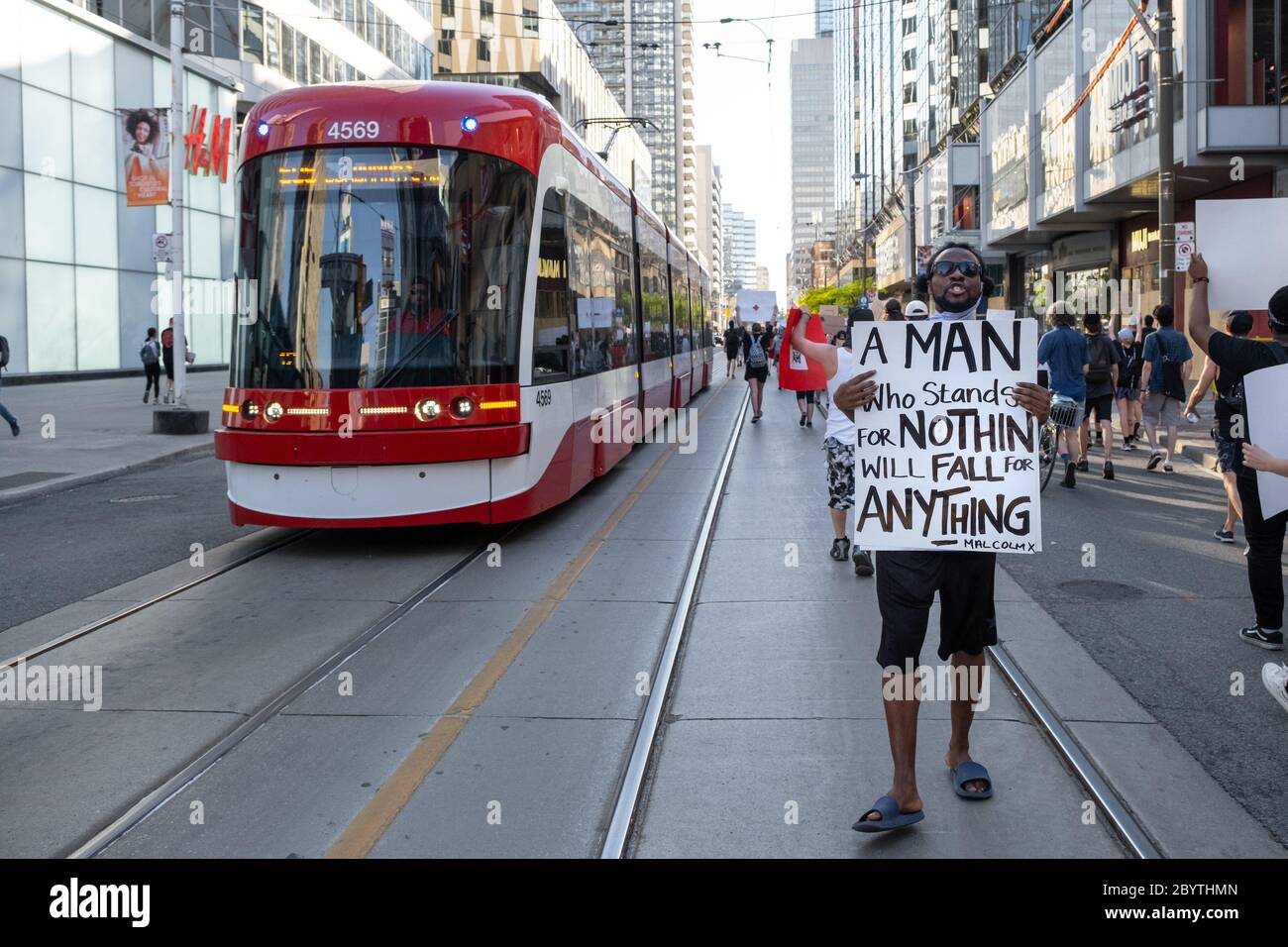A protester quotes Malcolm X during a Black Lives Matter protest in Toronto, Ontario. Stock Photo