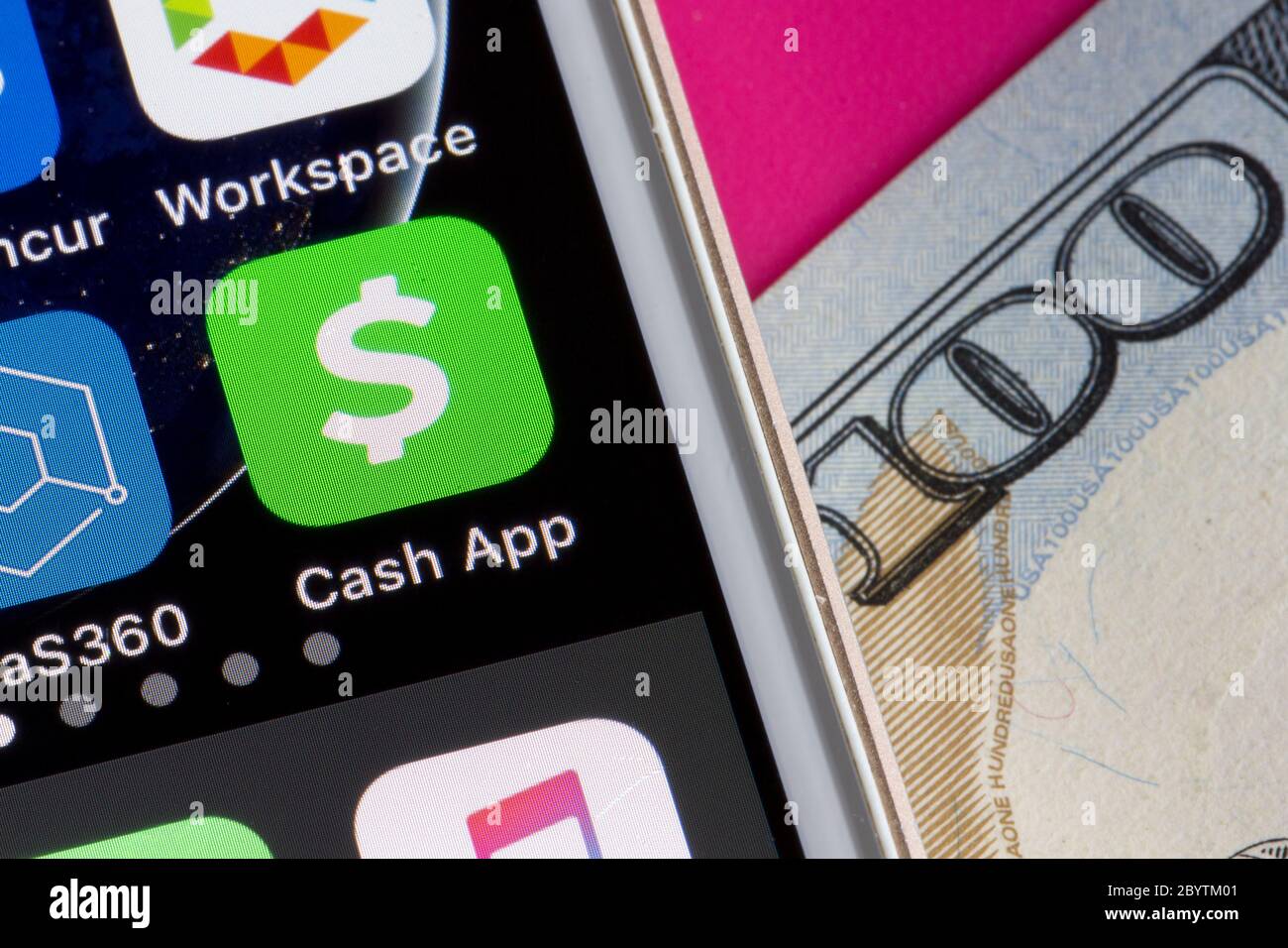 Cash App icon is seen on a smartphone. The mobile payment service is developed by Square Inc. Stock Photo