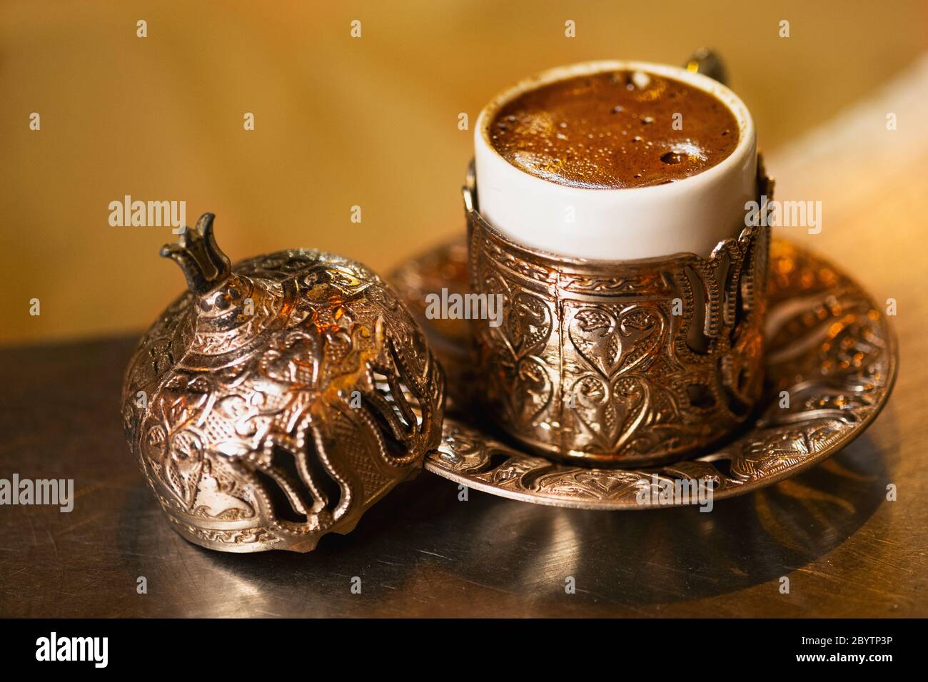 Turkish coffee, coffee in the sand. Ottoman style Turkish coffee cup