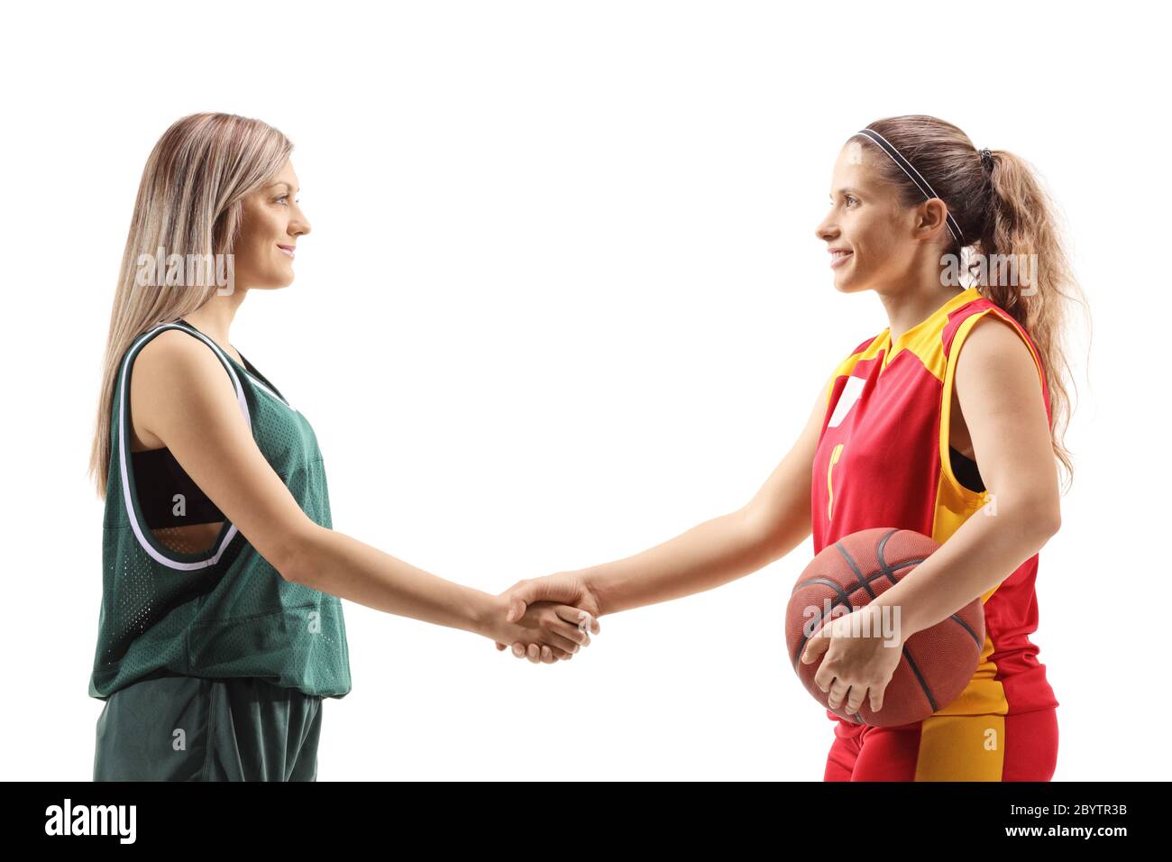 Female basketball players shaking hands isolated on white background