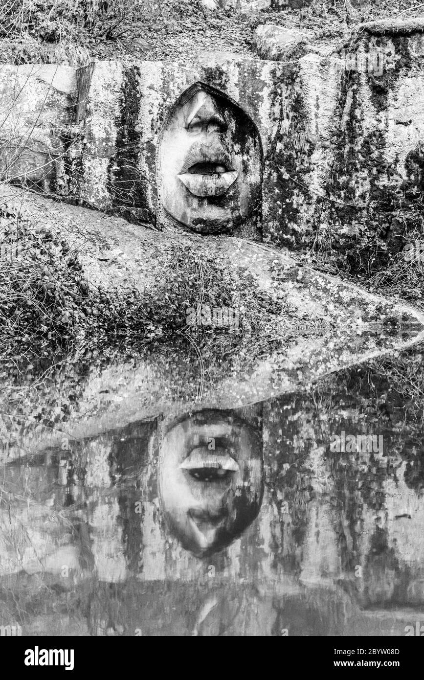LIPNICE NAD SAZAVOU, CZECH REPUBLIC - DECEMBER 31, 2018: Mouth of Truth scuplture in old granite rock quarry near Lipnice Castle. Black and white image. Stock Photo
